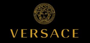 Bild på Versaces logga mot en svart bakgrund